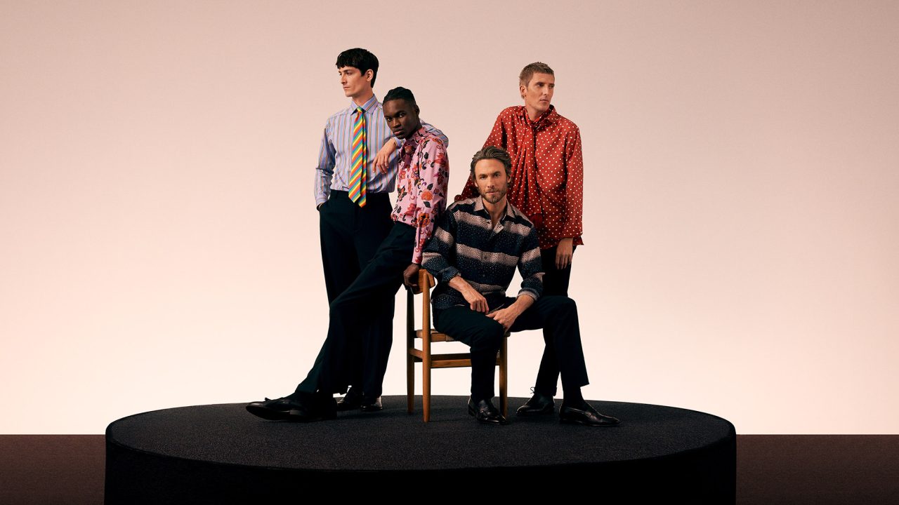 Four men in a group wearing the Eton Beatles shirt collection