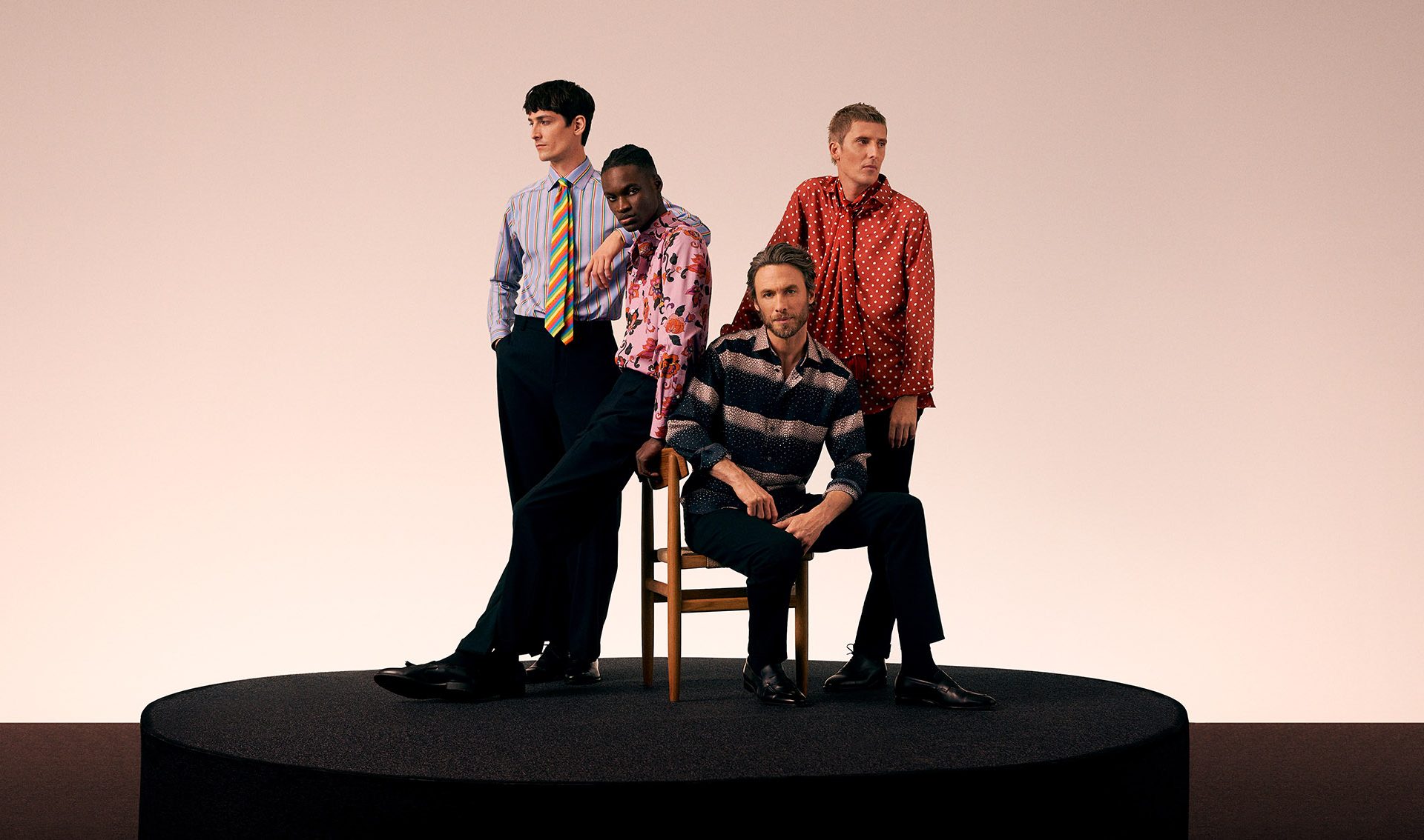 Four men in a group wearing the Eton Beatles shirt collection
