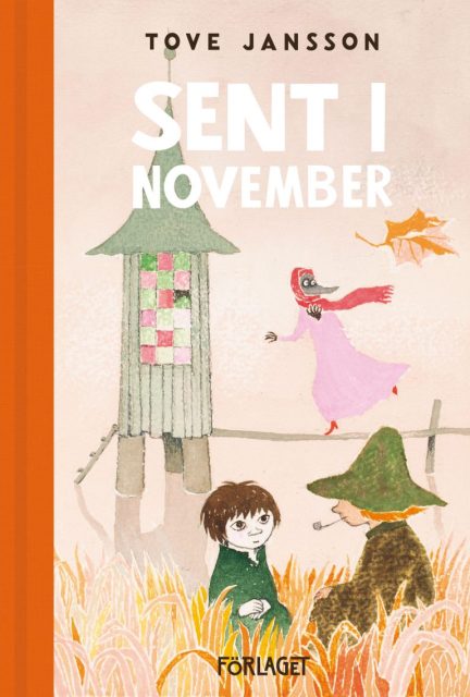 Cover of the ninth Moomin book Moominvalley in November with a pastel pink-beige background and Snufkin and Toffle sitting in the foreground on an orange, yellow and light pink coloured field.