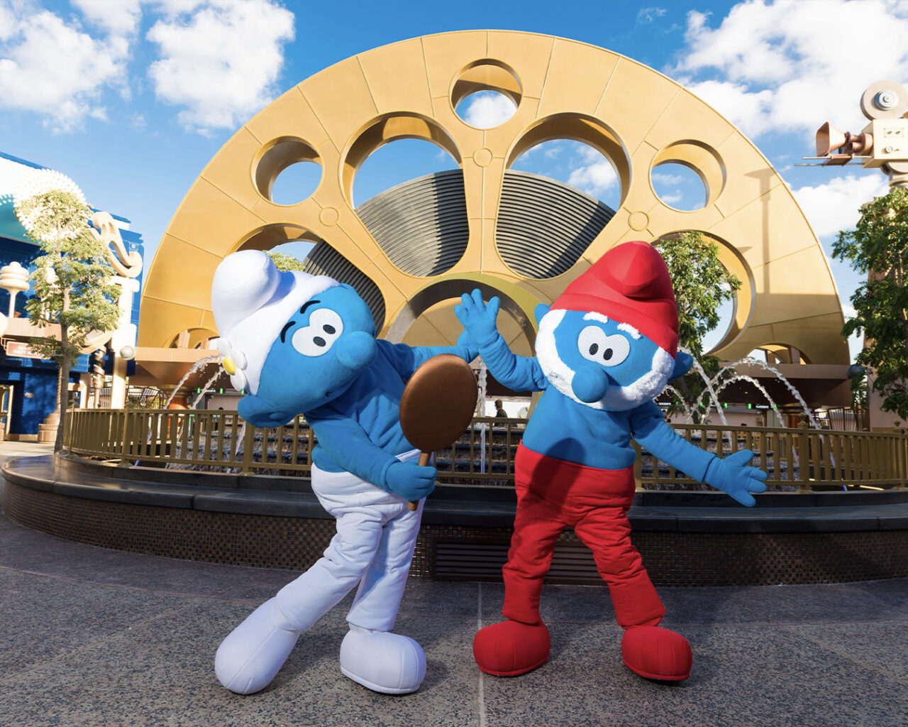 Two smurfs inside theme park